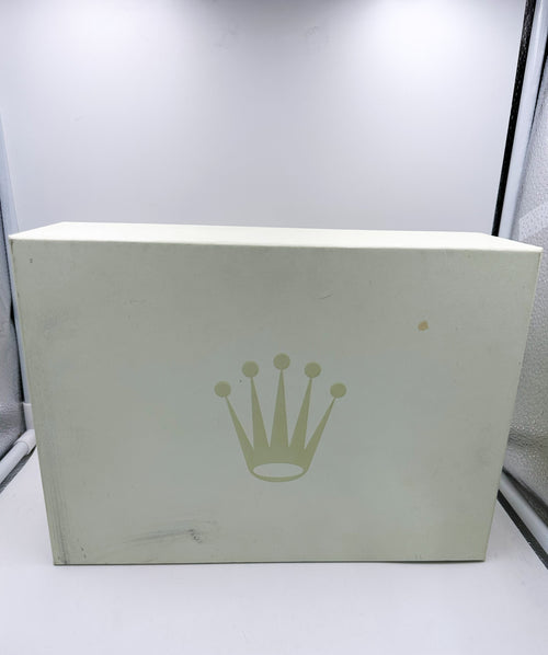 White box with a green crown logo on a light gray background