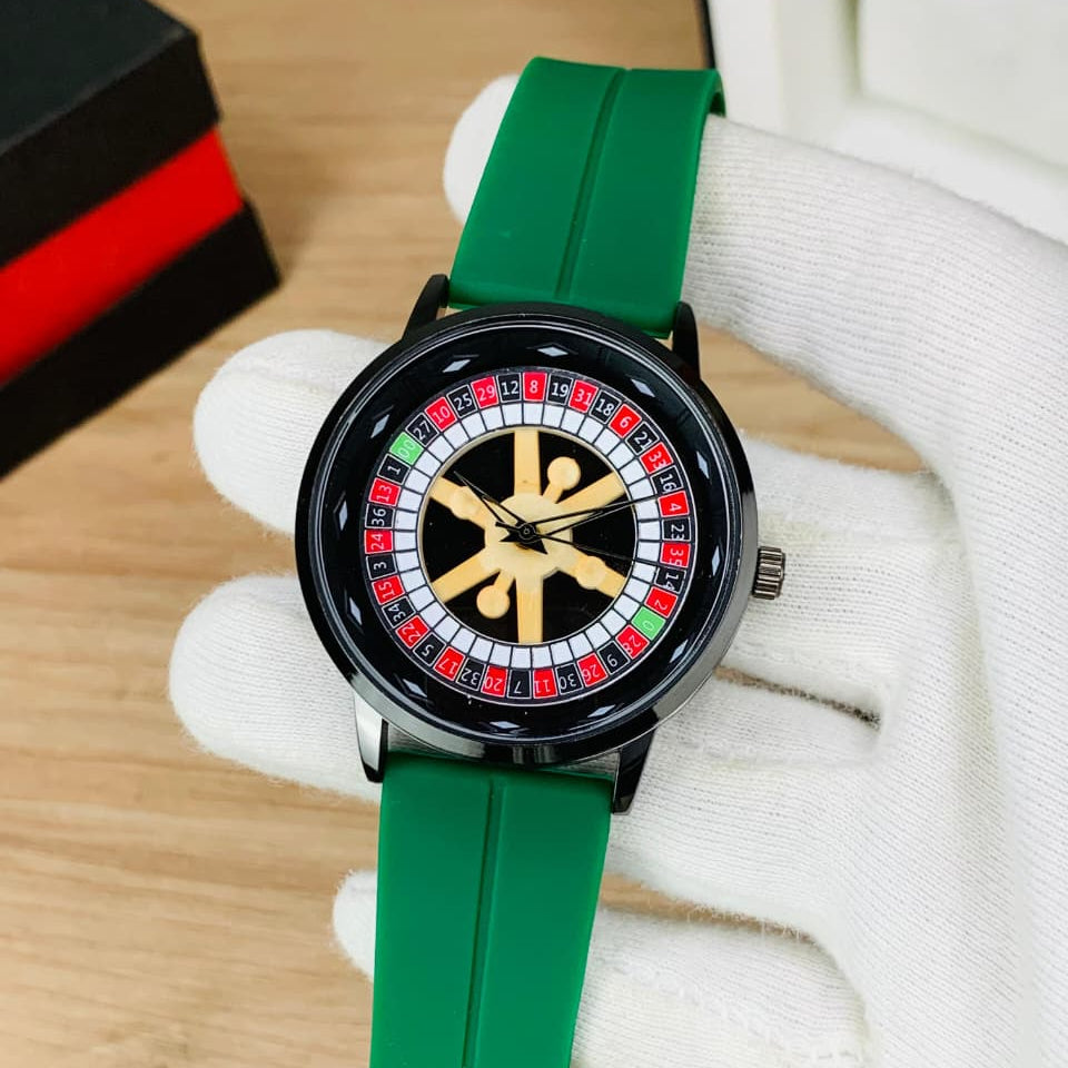 Wristwatch with green strap and unique face design on a wooden surface