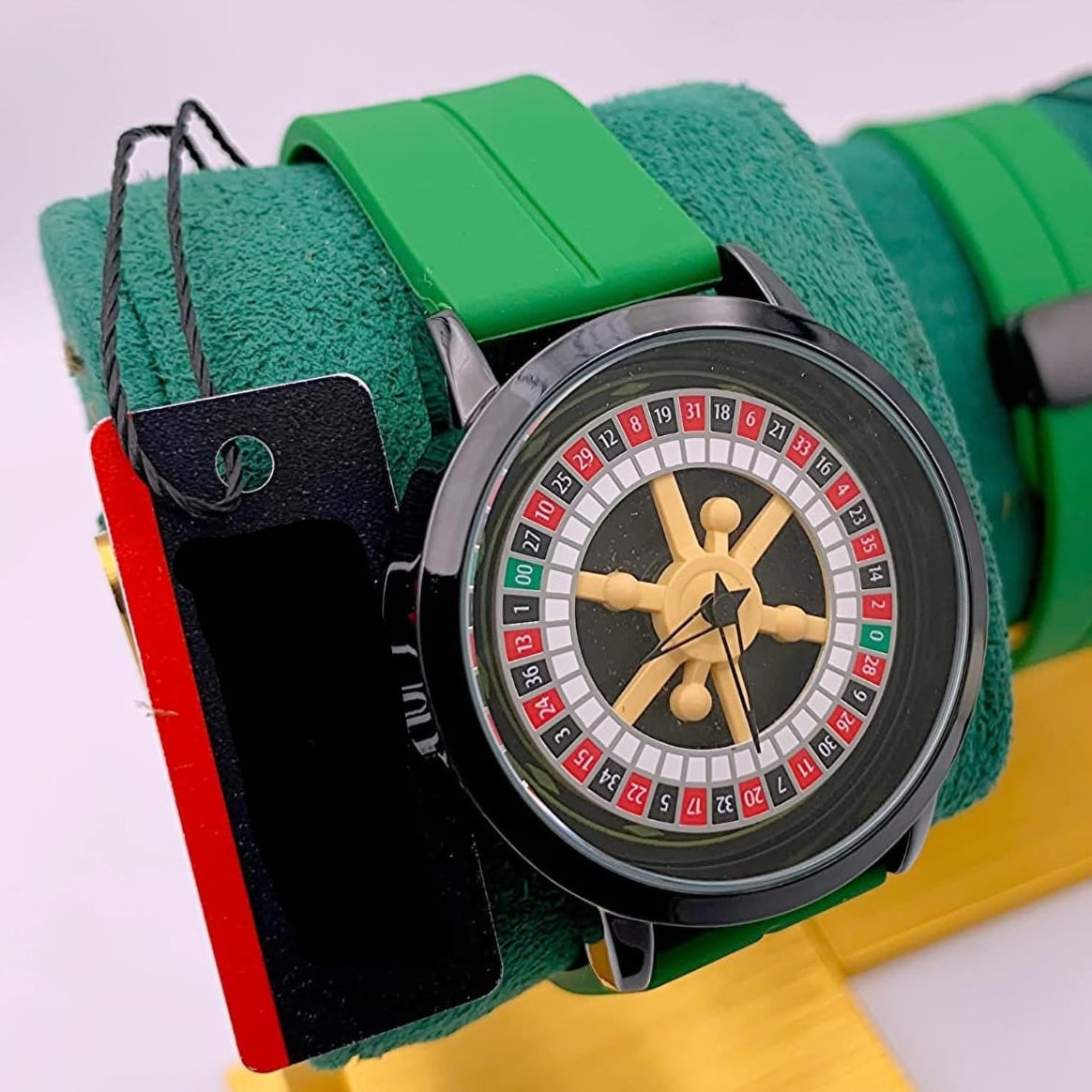 Wristwatch with green strap and roulette design on face, brand 'MILLER' visible